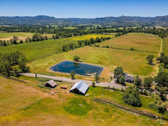 bird's eye view with a mountain view and a rural view