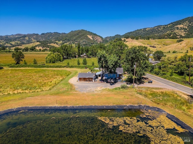 drone / aerial view with a mountain view and a rural view