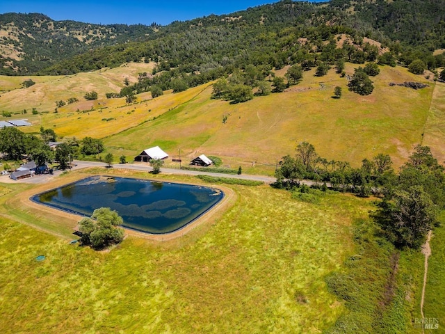 aerial view featuring a rural view and a water view