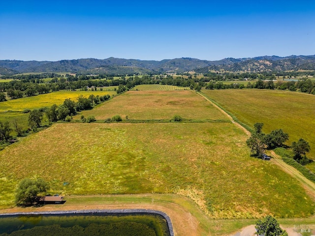 aerial view with a mountain view and a rural view