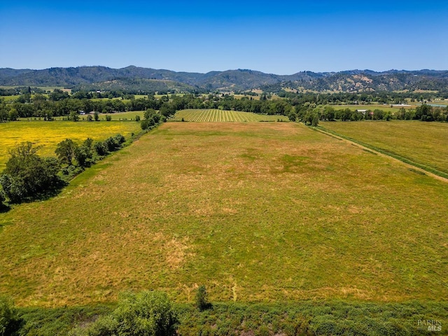 view of mountain feature with a rural view