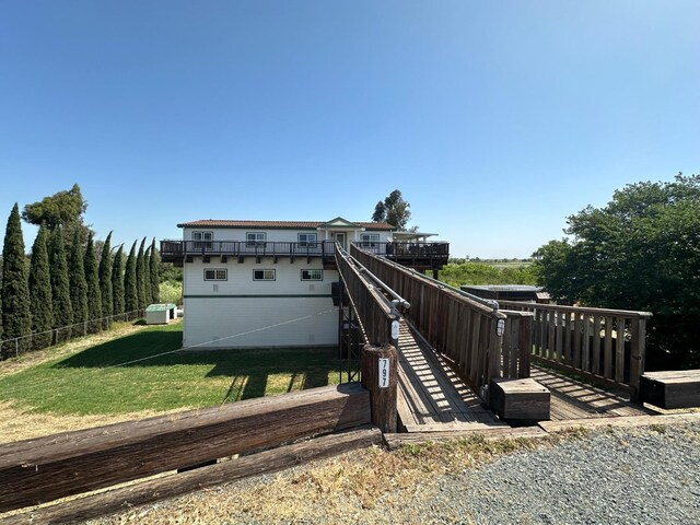 exterior space featuring a yard and a deck