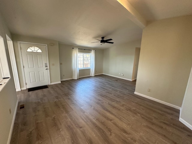 foyer with dark wood-style floors, visible vents, baseboards, and a ceiling fan