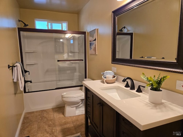 full bathroom with vanity, shower / bath combination with glass door, and toilet