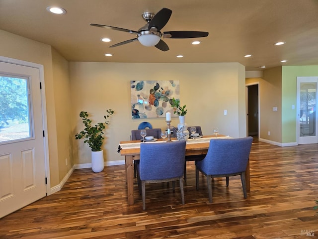 dining space featuring ceiling fan and dark hardwood / wood-style floors