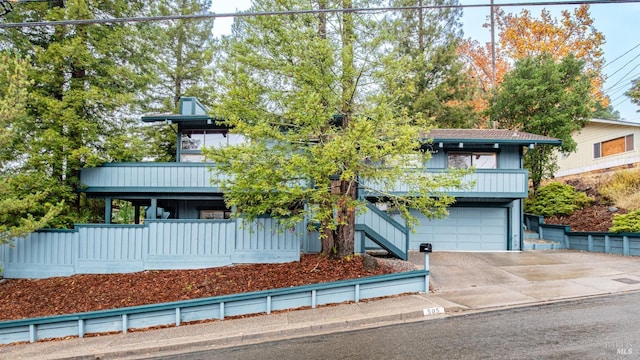 view of front of house with a garage and a balcony