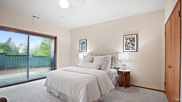 carpeted bedroom featuring ceiling fan and access to outside