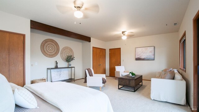 bedroom featuring light colored carpet and ceiling fan