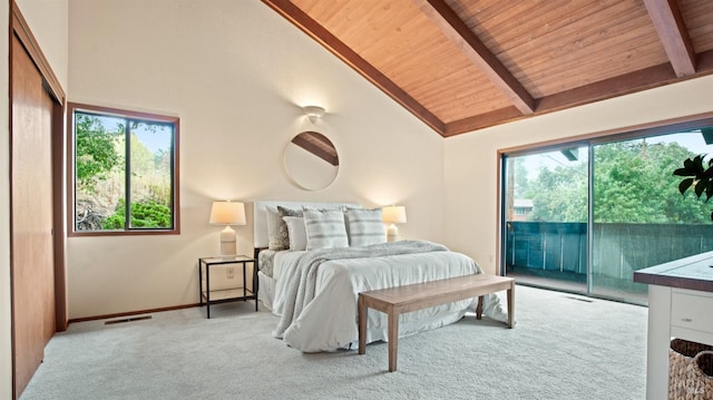 carpeted bedroom featuring beam ceiling, multiple windows, wood ceiling, and access to exterior