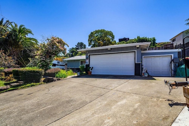 garage featuring driveway