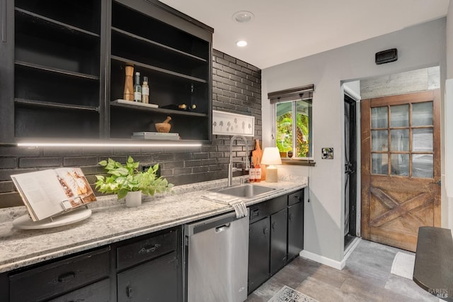 bar with tasteful backsplash, baseboards, dishwasher, a sink, and recessed lighting