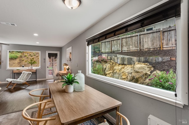 dining room with recessed lighting, visible vents, baseboards, and wood finished floors