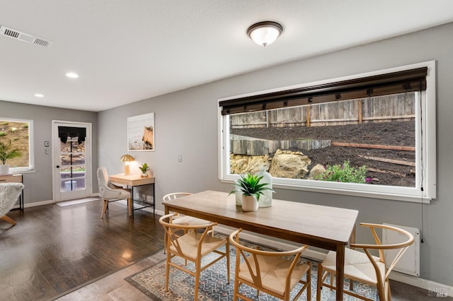 dining area featuring recessed lighting, dark wood finished floors, visible vents, and baseboards