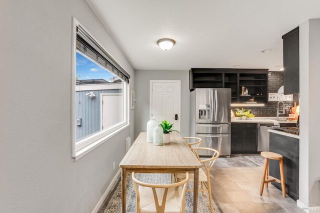 dining space with baseboards