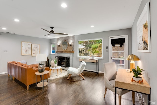 living room featuring dark wood-style floors, recessed lighting, and baseboards