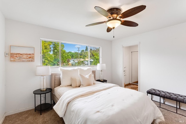 bedroom with carpet floors, baseboards, and a ceiling fan