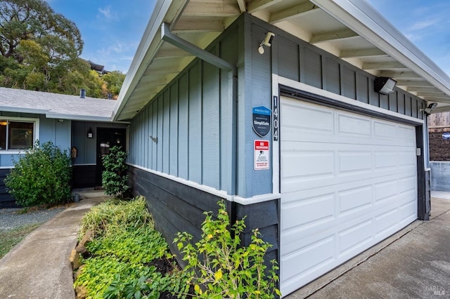 exterior space featuring board and batten siding and driveway