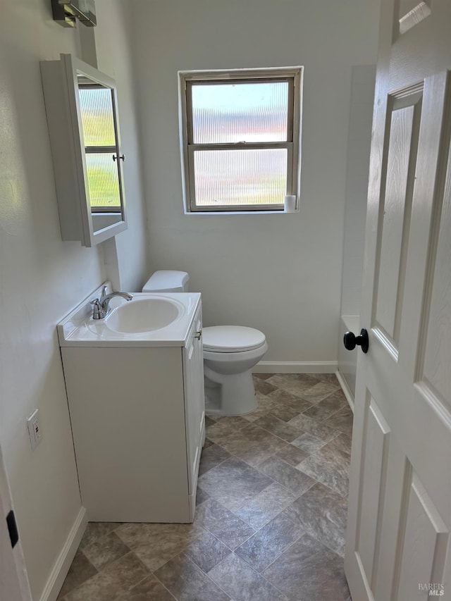 bathroom featuring tile flooring, oversized vanity, and toilet