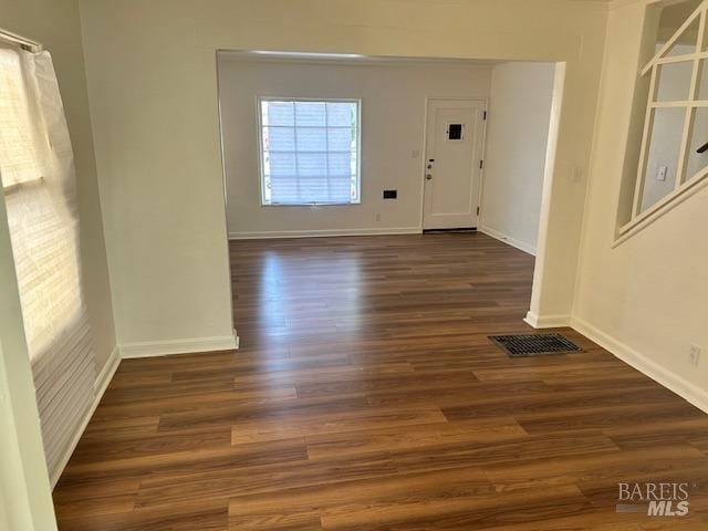 foyer entrance with dark wood-type flooring