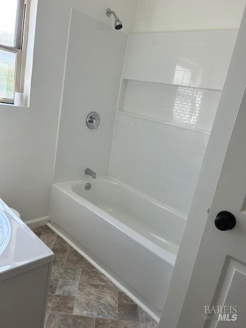 bathroom with vanity, shower / washtub combination, and tile floors