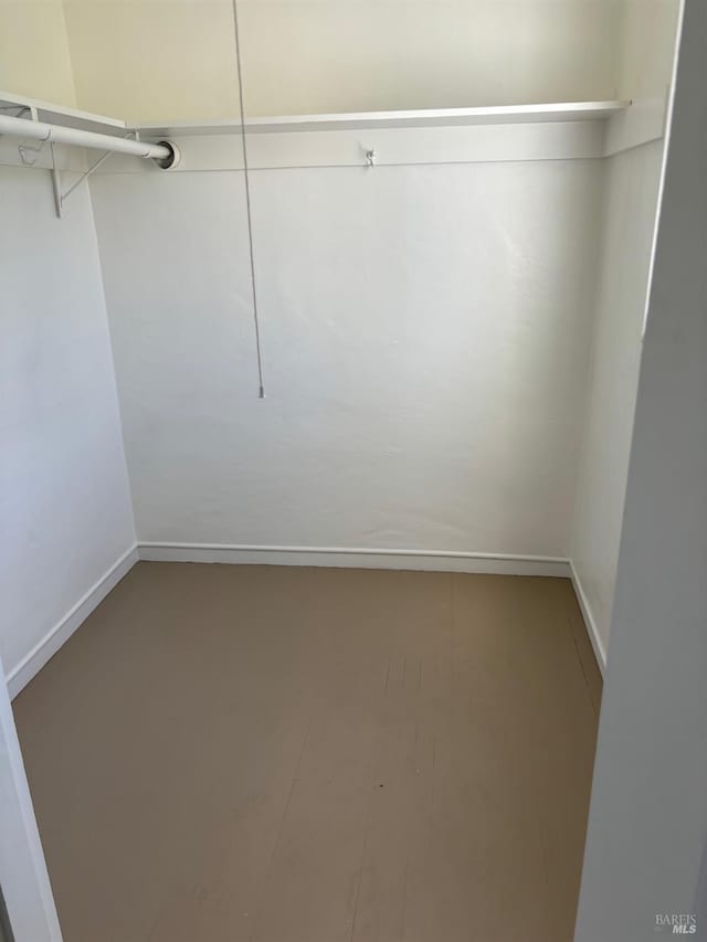 walk in closet featuring hardwood / wood-style floors