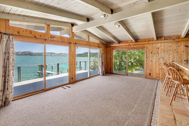 unfurnished sunroom with visible vents, wood ceiling, a water view, vaulted ceiling with beams, and track lighting