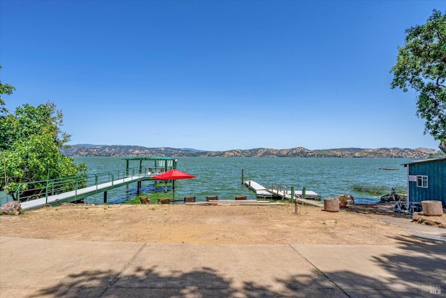 dock area with a water and mountain view