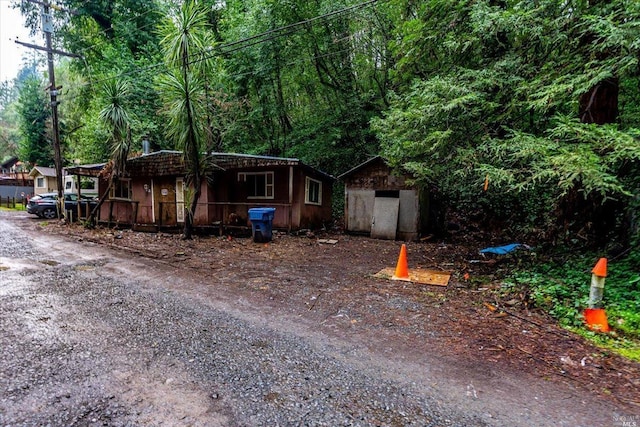 view of front facade with a shed