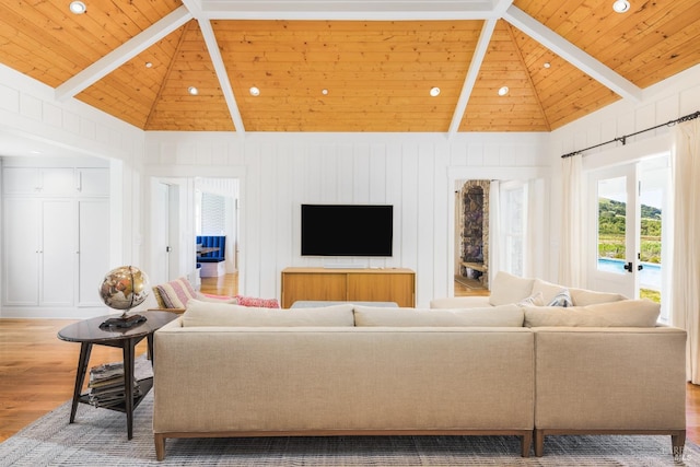 living room featuring high vaulted ceiling, beam ceiling, hardwood / wood-style flooring, and wood ceiling