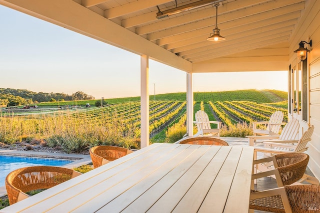 wooden terrace featuring a rural view