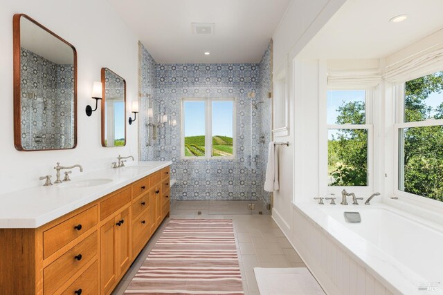 bathroom featuring tile floors, a wealth of natural light, and large vanity