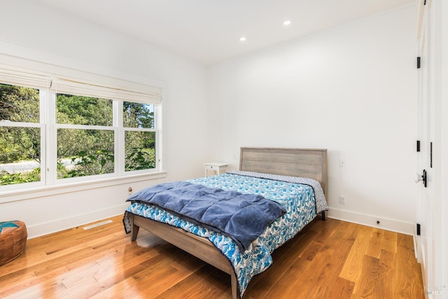 bedroom featuring hardwood / wood-style flooring