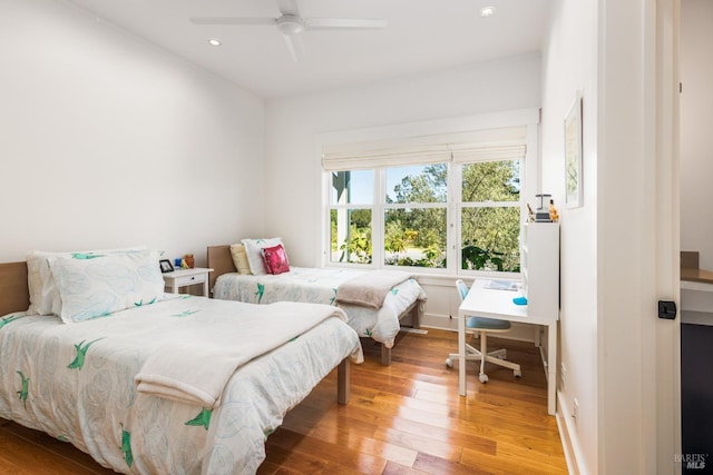 bedroom featuring ceiling fan and light hardwood / wood-style floors