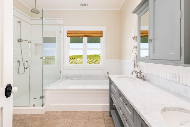 bathroom with tile floors, independent shower and bath, double sink, and oversized vanity