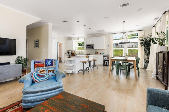 living room with light hardwood / wood-style floors