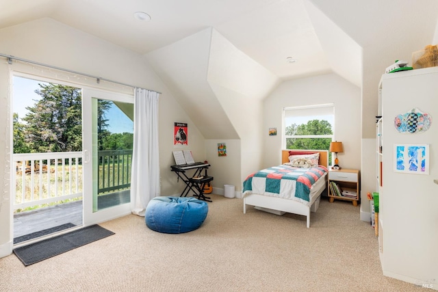 bedroom with vaulted ceiling, carpet floors, access to outside, and multiple windows