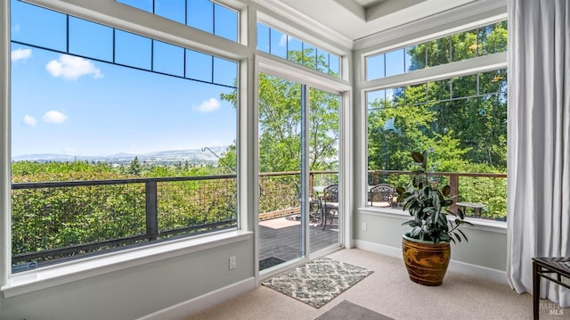 sunroom featuring a mountain view