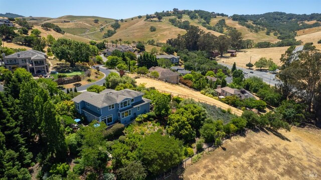 birds eye view of property with a mountain view