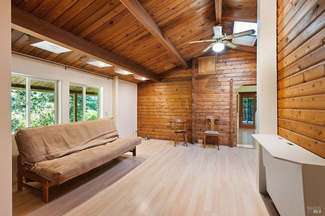 living room featuring lofted ceiling with beams, light hardwood / wood-style floors, wooden ceiling, and ceiling fan