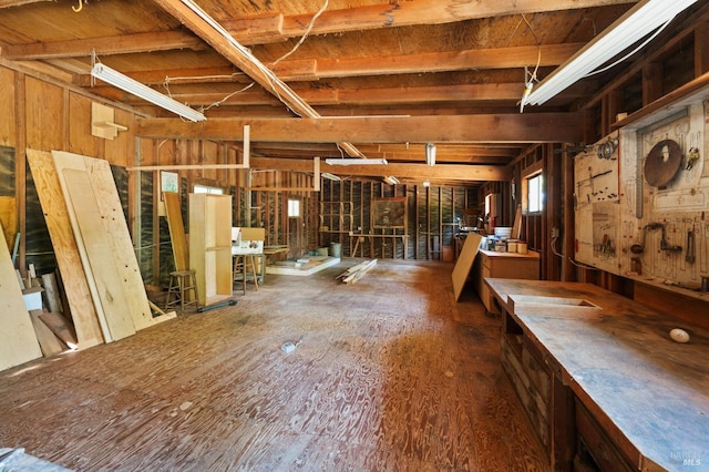 misc room with wooden walls and hardwood / wood-style flooring