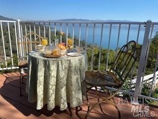 balcony featuring a water view