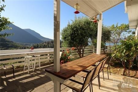 view of patio / terrace featuring a mountain view