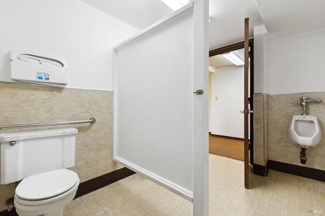 bathroom featuring tile floors, a bidet, and toilet