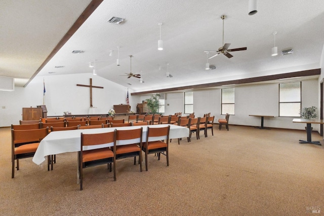 dining room featuring light carpet, lofted ceiling, and ceiling fan