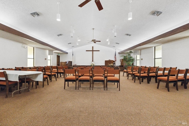 dining room featuring a healthy amount of sunlight, light carpet, and lofted ceiling