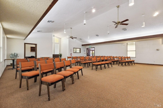 dining room with a textured ceiling, lofted ceiling, carpet, and ceiling fan