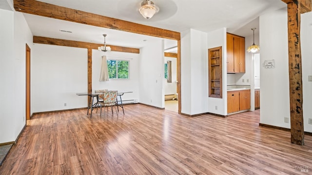 interior space featuring a baseboard heating unit, beamed ceiling, light wood-type flooring, and baseboards