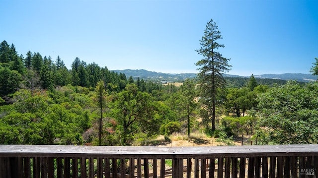 view of mountain feature with a forest view