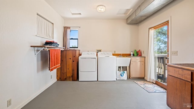 laundry area featuring baseboards and washer and dryer