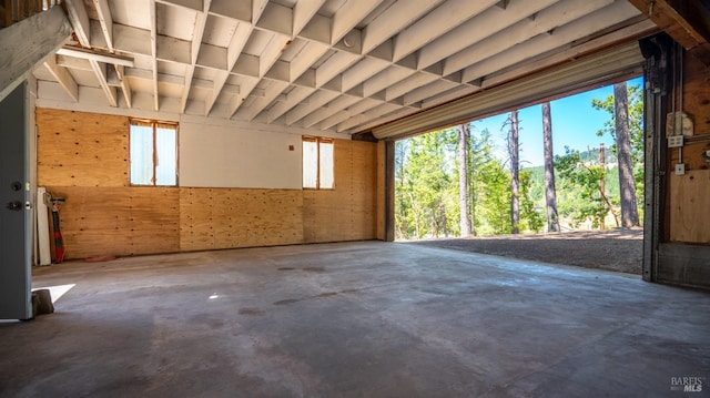 miscellaneous room with unfinished concrete flooring